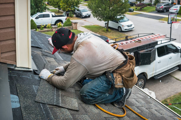Professional Storm Damage Roof Repair technician working in Wellington, KS